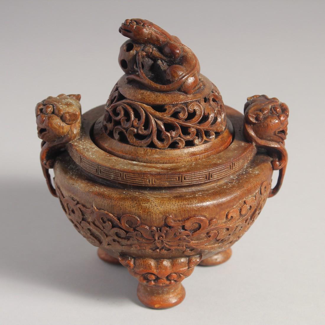 AN UNUSUAL CARVED WOOD TRIPOD CENSER AND COVER, 15cm high.: AN UNUSUAL CARVED WOOD TRIPOD CENSER AND COVER, 15cm high.