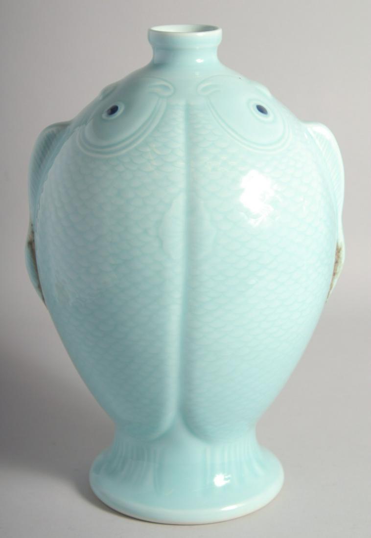 AN UNUSUAL CHINESE CELADON GLAZE TWIN-FISH FORMED VASE, six-character mark to base, 33.5cm high. (1 of 7)
