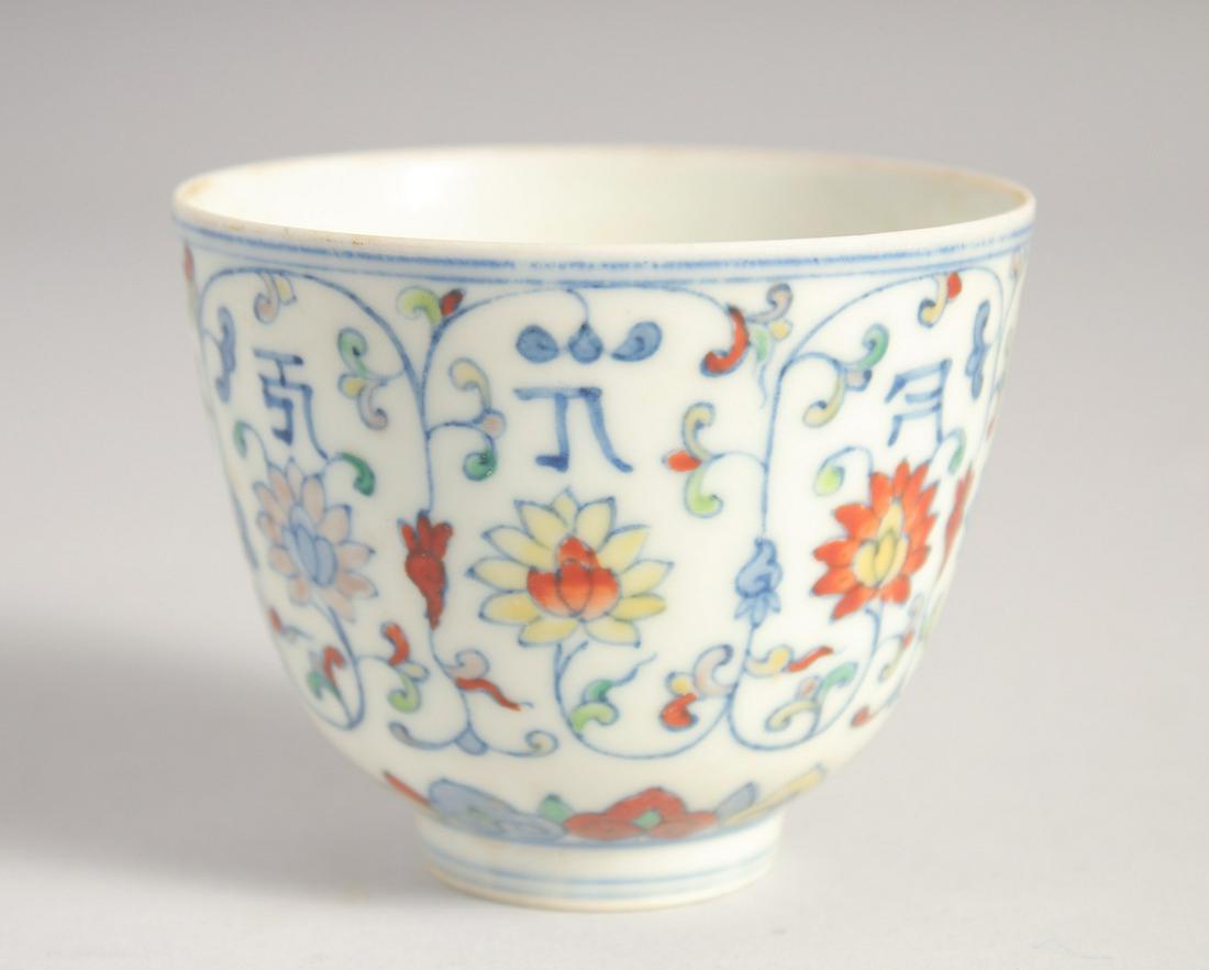 A CHINESE DOUCAI PORCELAIN CUP, six-character mark to base, 6cm high. (1 of 6)