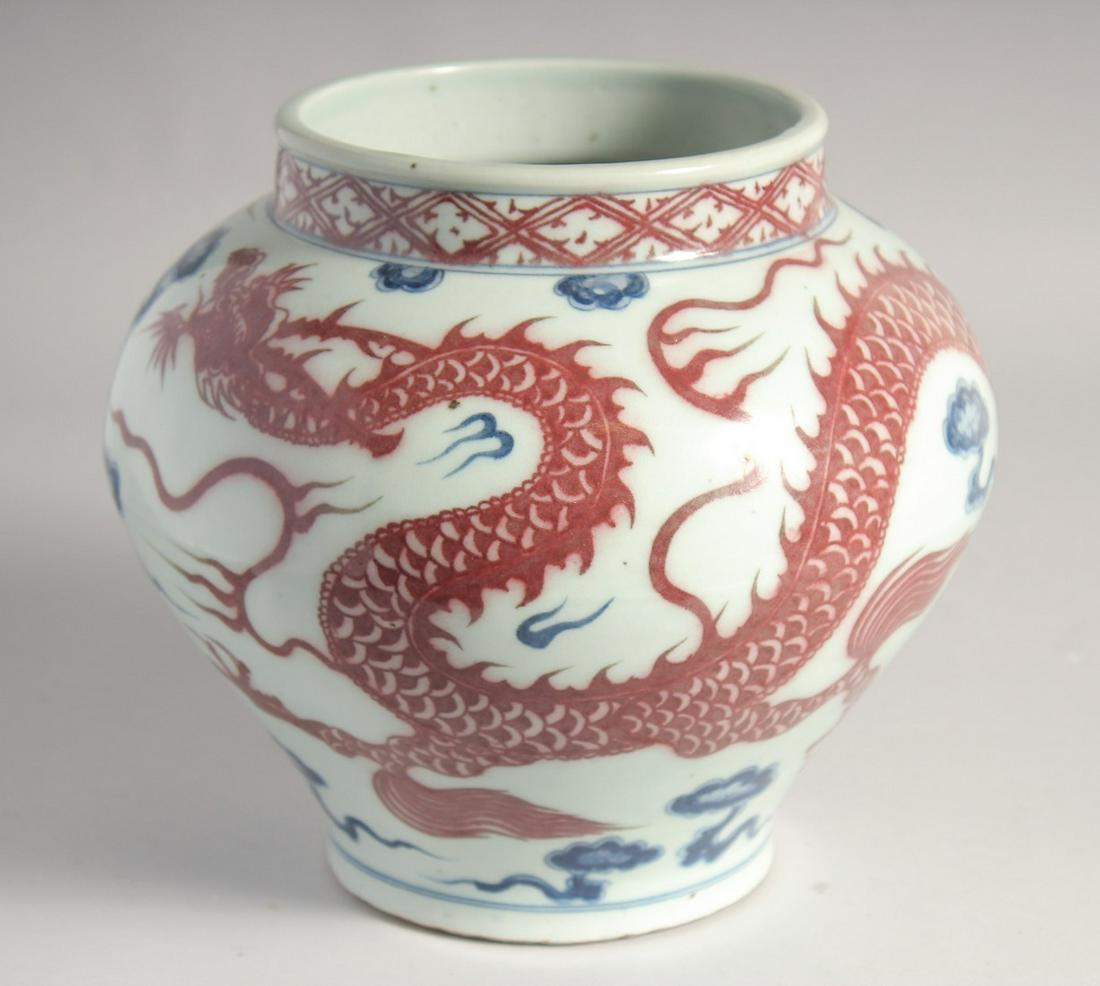 A CHINESE BLUE AND UNDERGLAZE RED PORCELAIN DRAGON JAR, 22cm high. (1 of 7)