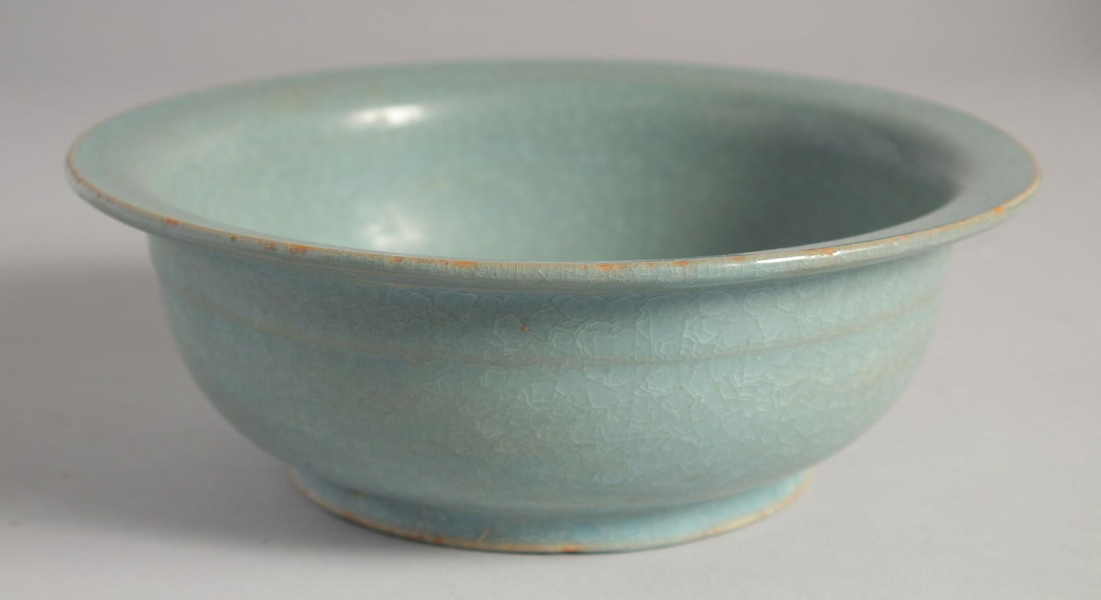 A CHINESE RU STYLE CELADON CRACKLE GLAZE BOWL, 22cm diameter. (1 of 3)