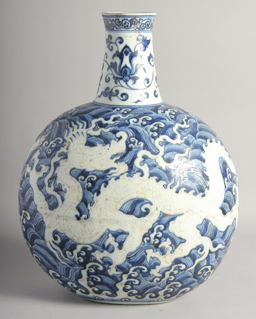 A VERY LARGE CHINESE BLUE AND WHITE PORCELAIN MOON FLASK VASE, decorated with a central dragon (1 of 6)