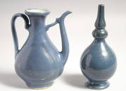 A CHINESE MING DYNASTY MONOCHROME-BLUE WINE EWER, together with a bottle vase in a fitted