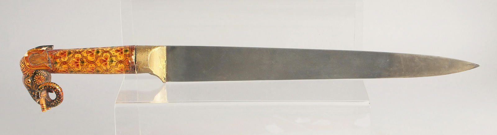 A 19TH CENTURY INDIAN RAJASTHAN DAGGER, with a carved and painted bone handle in the form of an: A 19TH CENTURY INDIAN RAJASTHAN DAGGER, with a carved and painted bone handle in the form of an elephant, the dagger with wootz steel blade. 37.5cm long overall