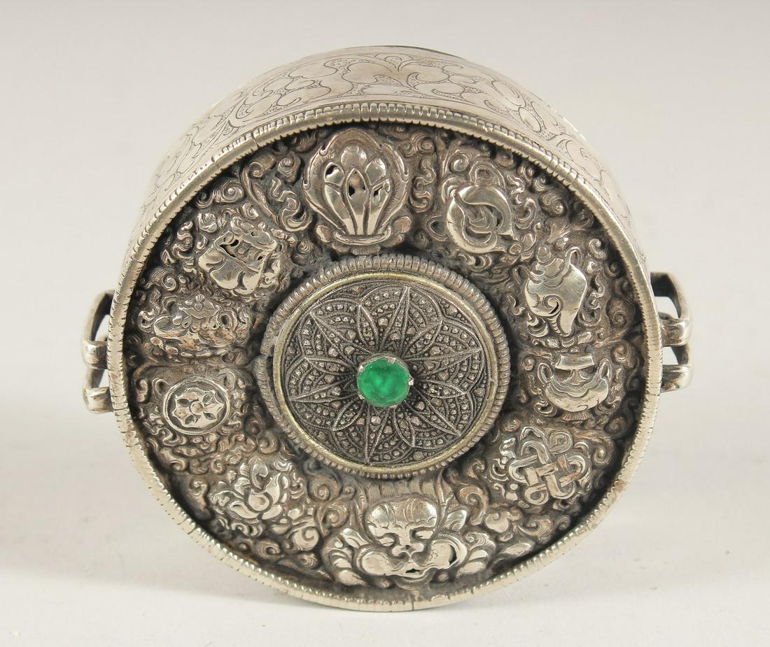 AN ISLAMIC SILVER CIRCULAR BOX, 10.5cm diameter. (1 of 3)