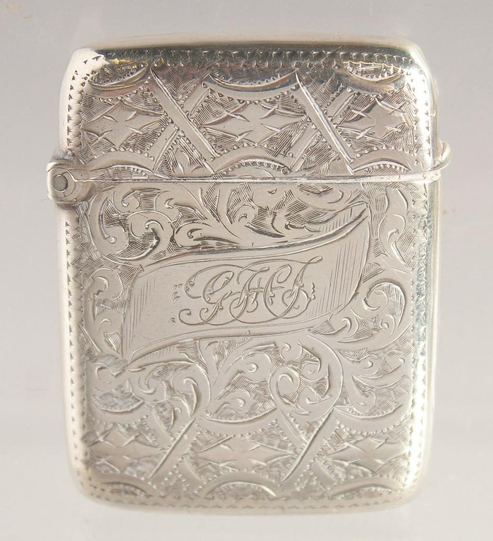 A VICTORIAN ENGRAVED SILVER VESTA. 1.75ins x 1.25ins. Birmingham.: A VICTORIAN ENGRAVED SILVER VESTA. 1.75ins x 1.25ins. Birmingham.