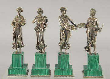 A SUPERB SET OF FOUR SILVER CLASSICAL FIGURES ON MALACHITE BASES.  Mark: head 84, Faberge mark.