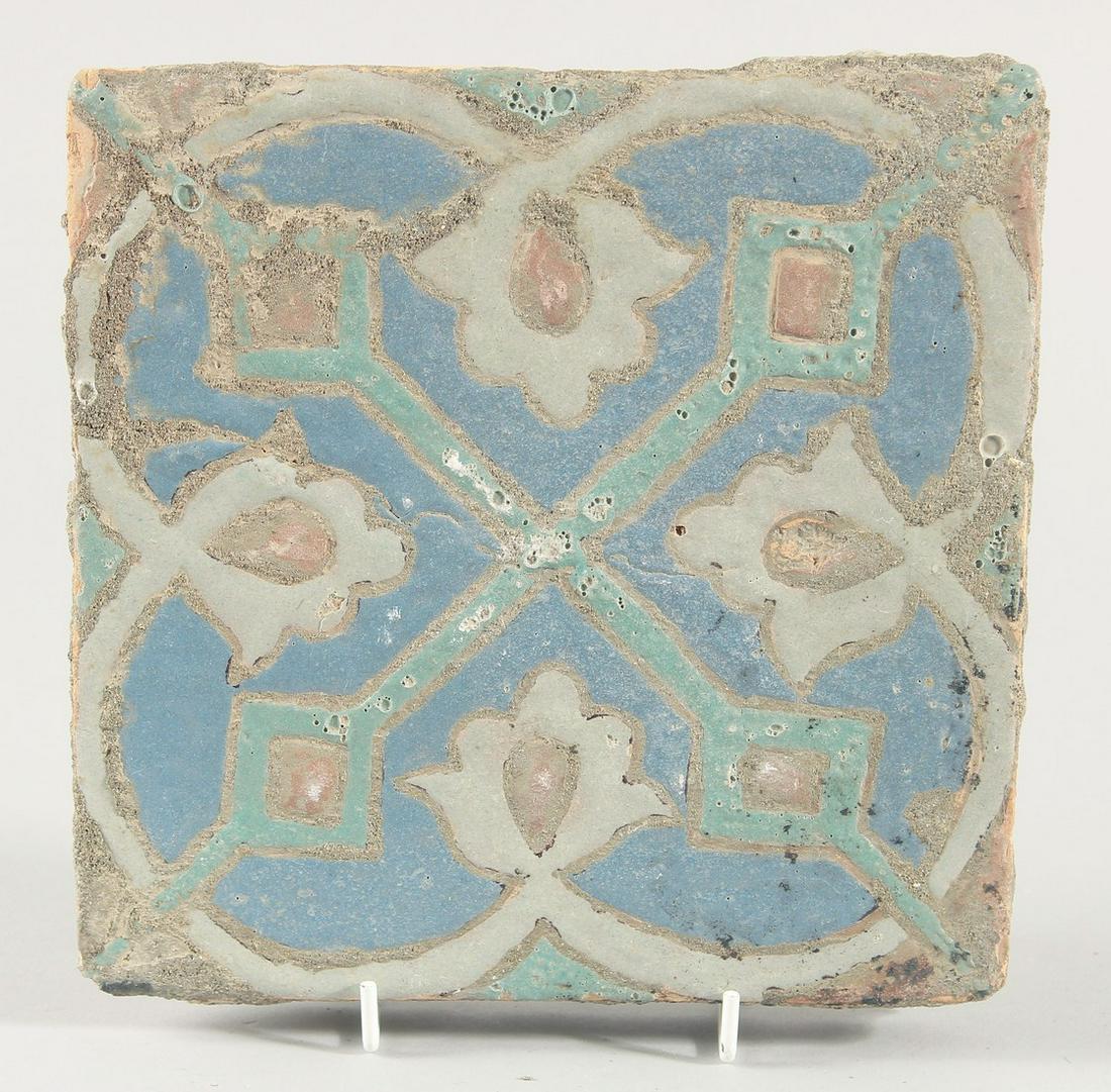 A PERSIAN SAFAVID CUERDA SECA POTTERY TILE, 20cm square.: A PERSIAN SAFAVID CUERDA SECA POTTERY TILE, 20cm square.