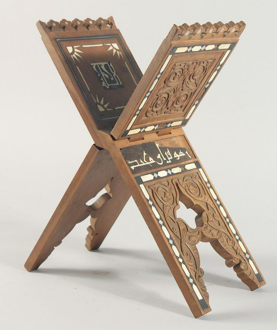 A FINE 19TH CENTURY OTTOMAN BONE AND MOTHER OF PEARL INLAID WOODEN QURAN STAND, with panels of: A FINE 19TH CENTURY OTTOMAN BONE AND MOTHER OF PEARL INLAID WOODEN QURAN STAND, with panels of calligraphy, 36.5cm (open).