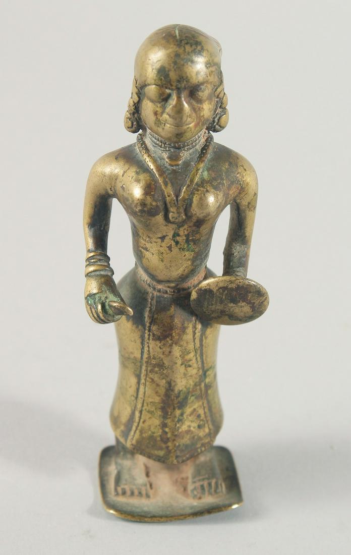 A RARE 17TH CENTURY MUGHAL INDIAN HOLLOWED BRONZE FIGURE of a female warrior, 13.5cm high.: A RARE 17TH CENTURY MUGHAL INDIAN HOLLOWED BRONZE FIGURE of a female warrior, 13.5cm high.