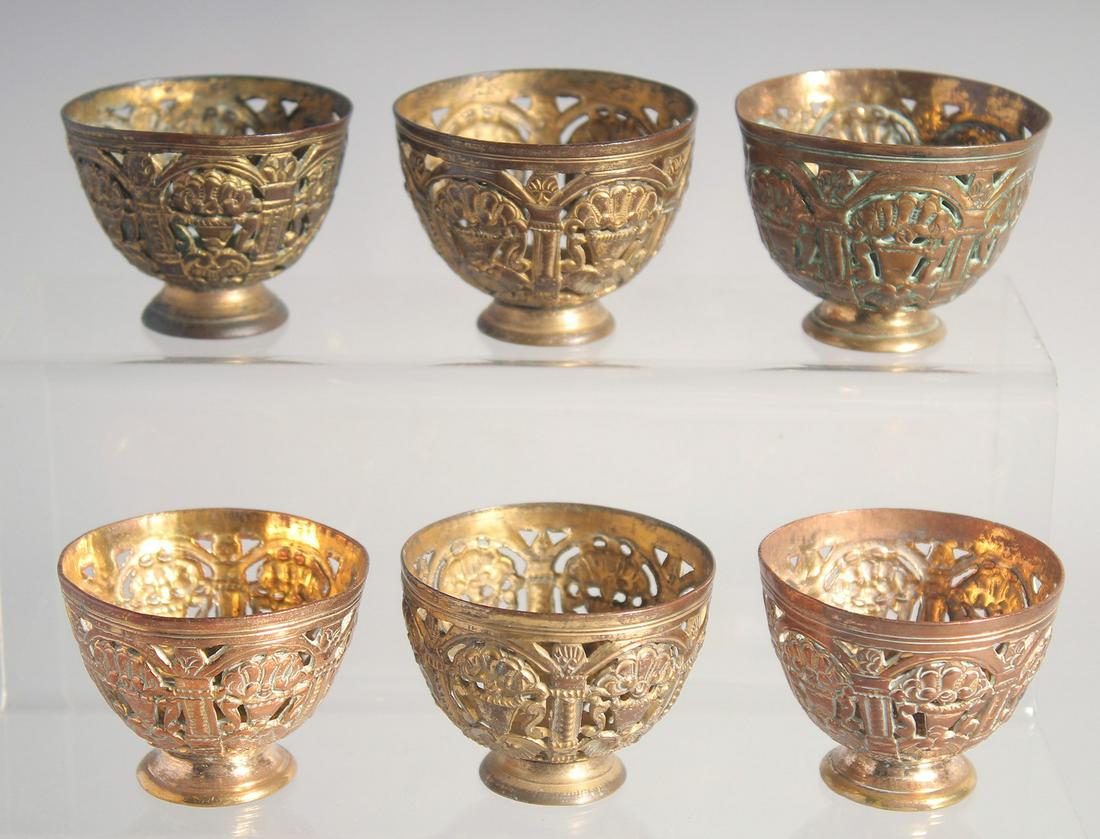 A VERY FINE SET OF SIX 18TH/19TH CENTURY OTTOMAN TURKISH GILDED COPPER TOMBAK OPENWORK ZARF CUPS,: A VERY FINE SET OF SIX 18TH/19TH CENTURY OTTOMAN TURKISH GILDED COPPER TOMBAK OPENWORK ZARF CUPS, each approx. 5.5cm diameter, (6).
