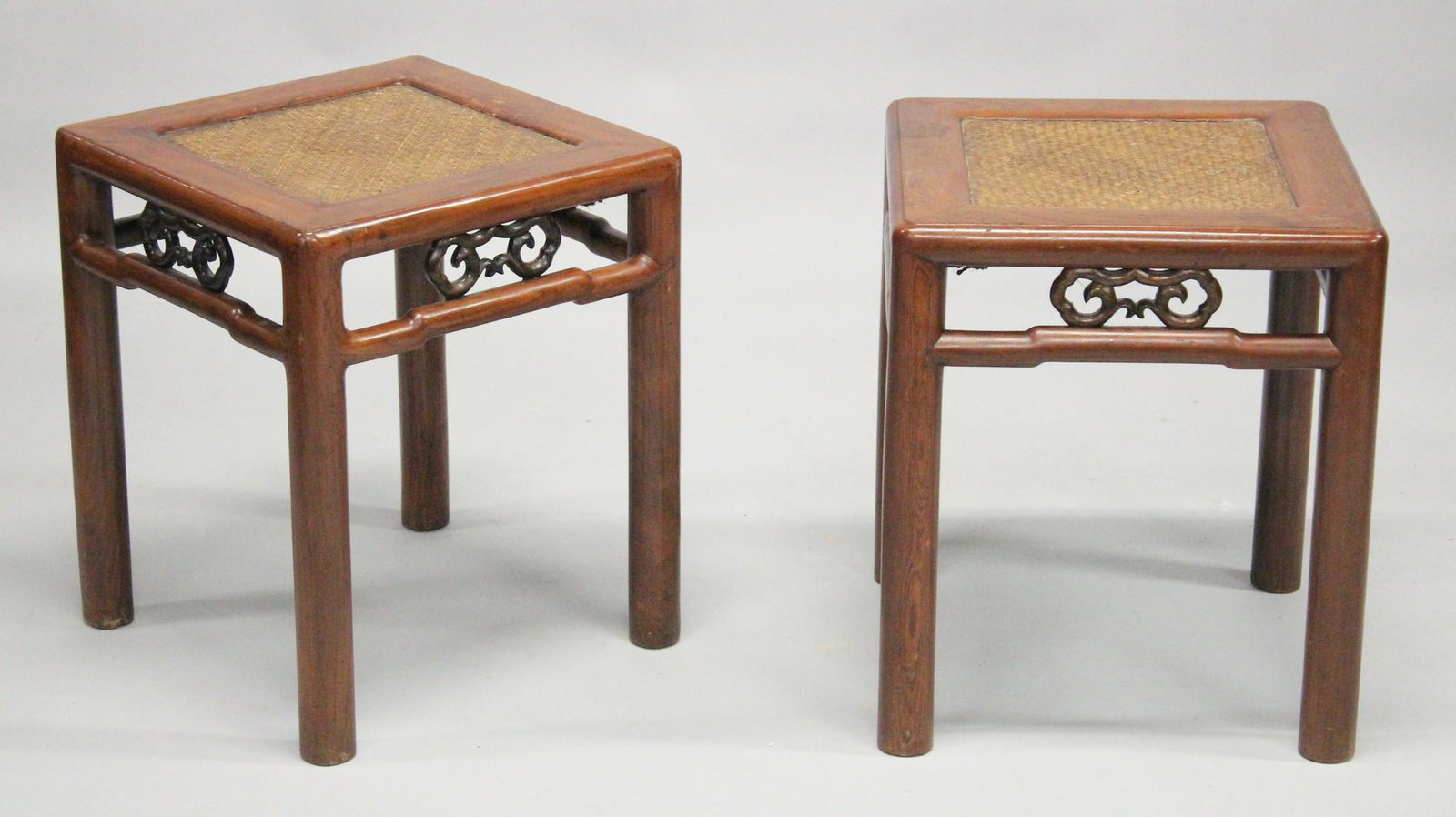 A PAIR OF CHINESE ELM SQUARE STOOLS, with woven bamboo panels on pole legs, 40cm wide, 48cm high.: A PAIR OF CHINESE ELM SQUARE STOOLS, with woven bamboo panels on pole legs, 40cm wide, 48cm high.