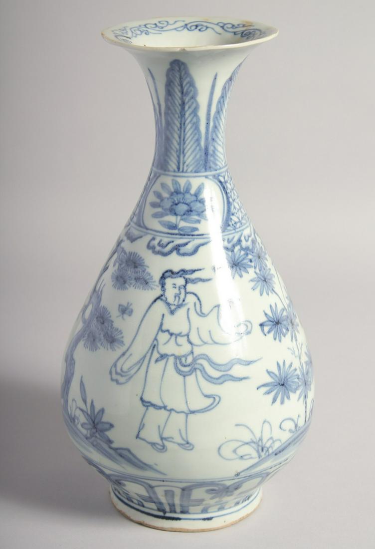 A CHINESE BLUE AND WHITE PORCELAIN VASE, decorated with figures in an outdoor setting, 29.5cm high.: A CHINESE BLUE AND WHITE PORCELAIN VASE, decorated with figures in an outdoor setting, 29.5cm high.