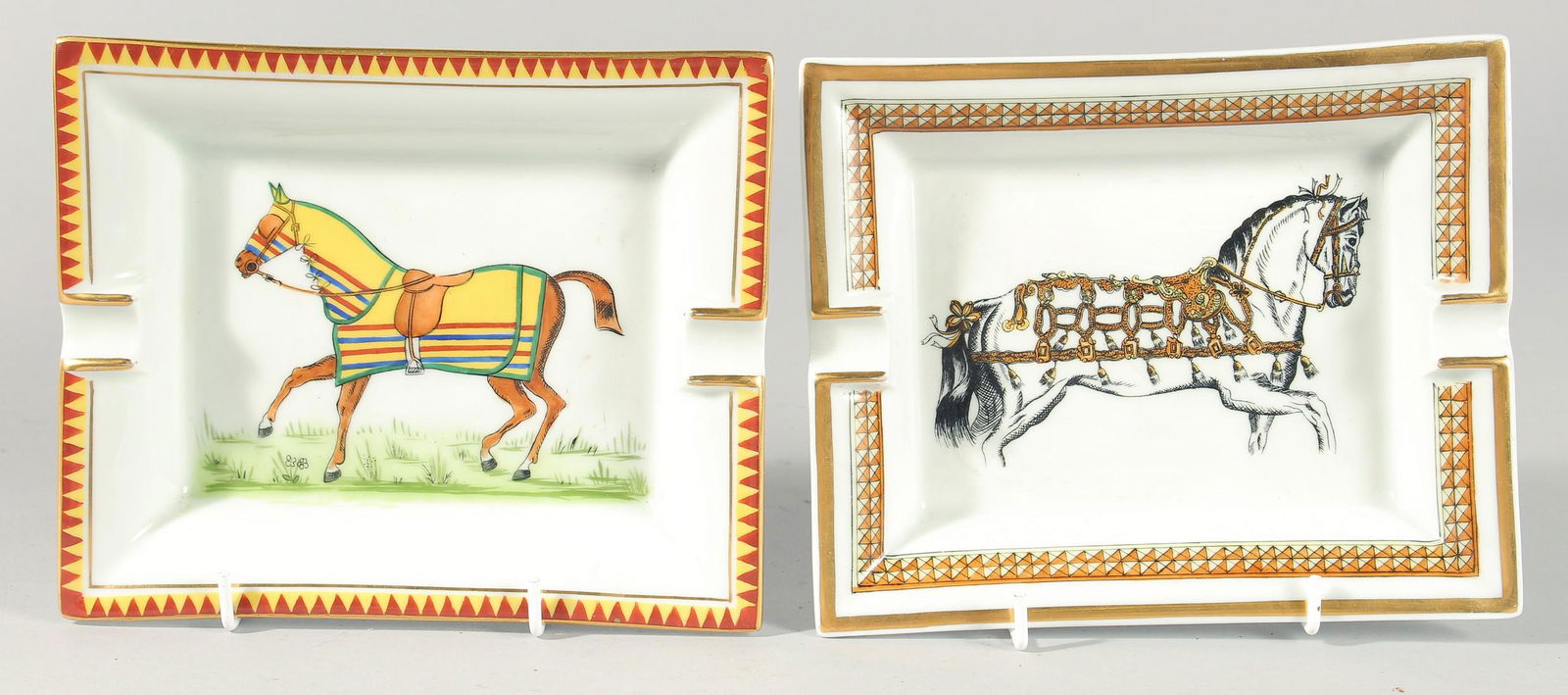 TWO HERMES OF PARIS PORCELAIN ASHTRAYS "HORSES". 7ins and 6ins.: TWO HERMES OF PARIS PORCELAIN ASHTRAYS DECORATED WITH HORSES. 7ins & 6ins.