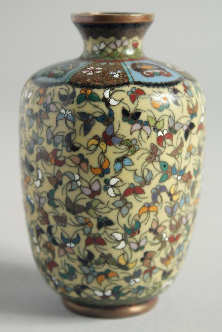 A SMALL CHINESE CLOISONNE ENAMEL VASE with butterflies.  3.5ins high. (1 of 5)