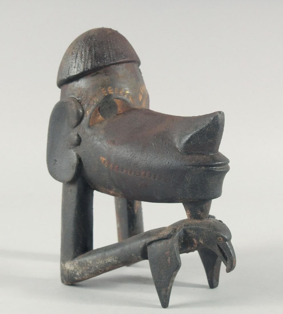 A CARVED WOOD TRIBAL HAND. 9ins high.: A CARVED WOOD TRIBAL HAND. 9ins high.