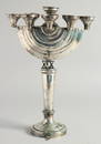 A GOOD JEWISH SILVER MENORAH on a circular base.  12ins high.