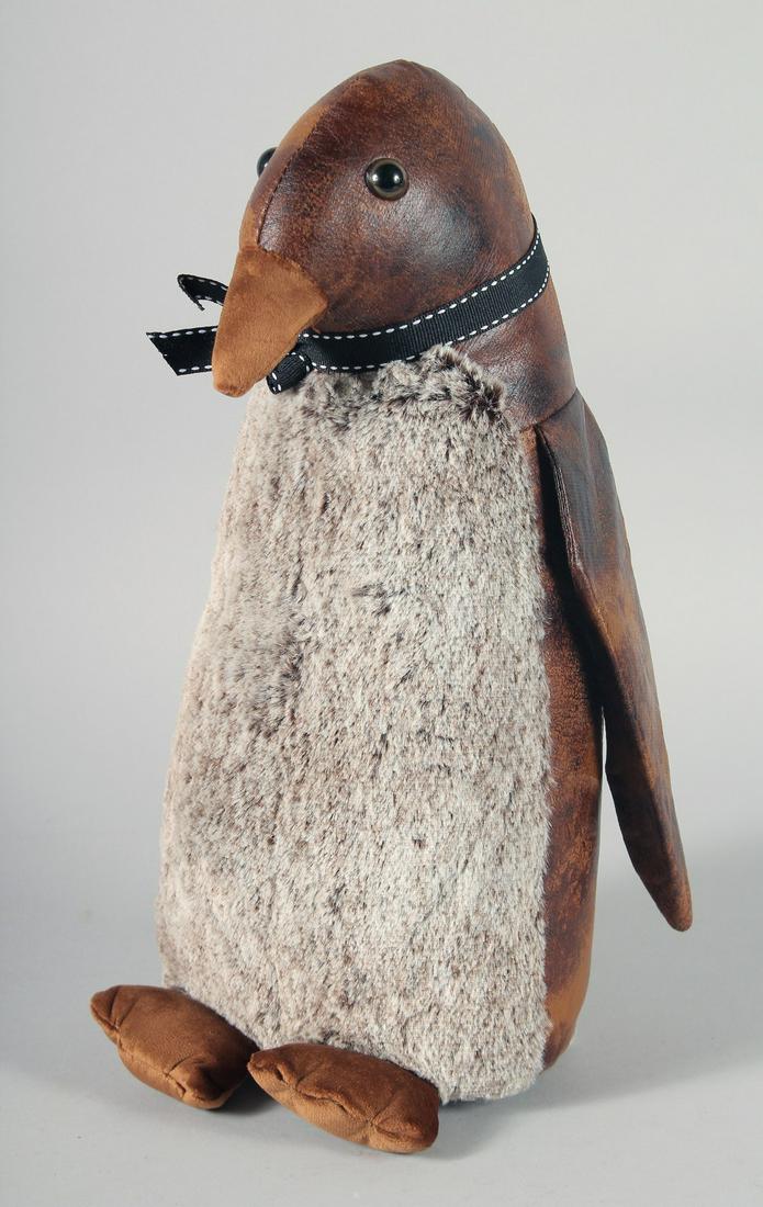 A PENGUIN LEATHER AND CLOTH DOORSTOP.: A PENGUIN LEATHER AND CLOTH DOORSTOP.