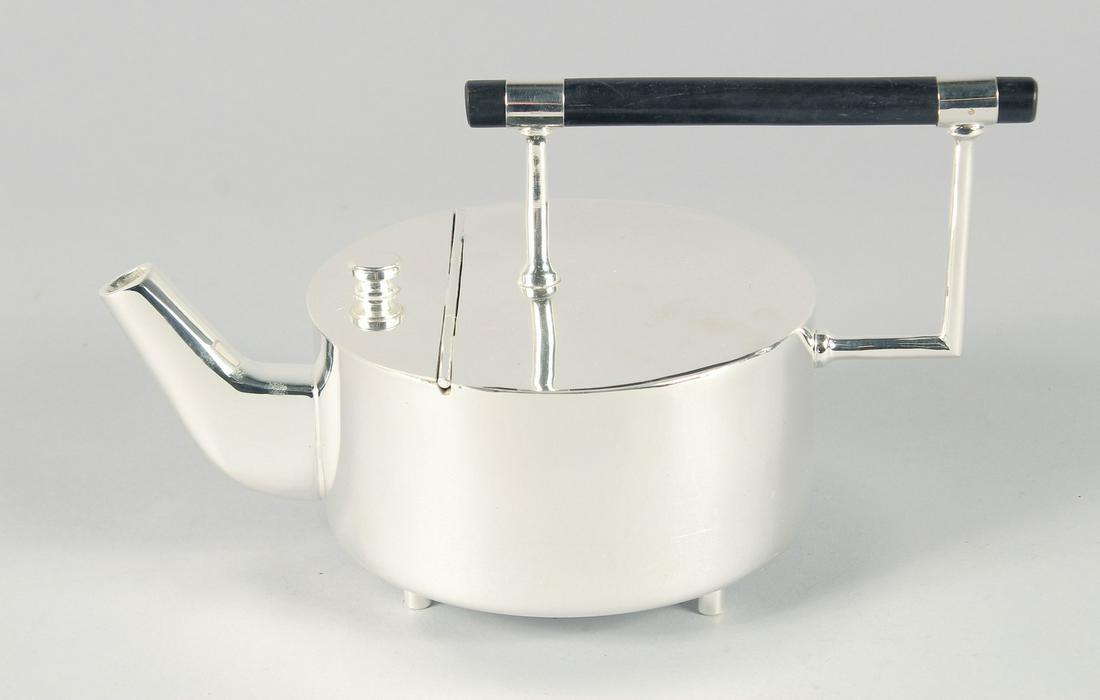 A CIRCULAR CHRISTOPHER DRESSER DESIGN SILVER PLATED CIRCULAR TEA POT. 5.25ins diameter.: A CIRCULAR CHRISTOPHER DRESSER DESIGN SILVER PLATED CIRCULAR TEA POT. 5.25ins diameter.