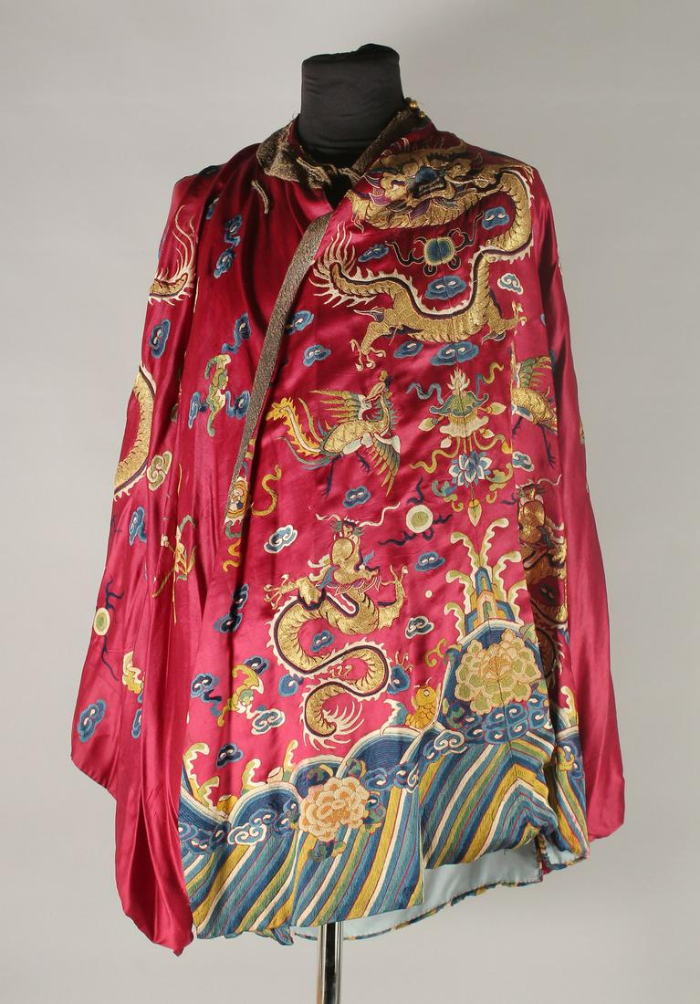 A CHINESE EMBROIDERED SILK JACKET, with embroidered dragons and phoenix.: A CHINESE EMBROIDERED SILK JACKET, with embroidered dragons and phoenix.