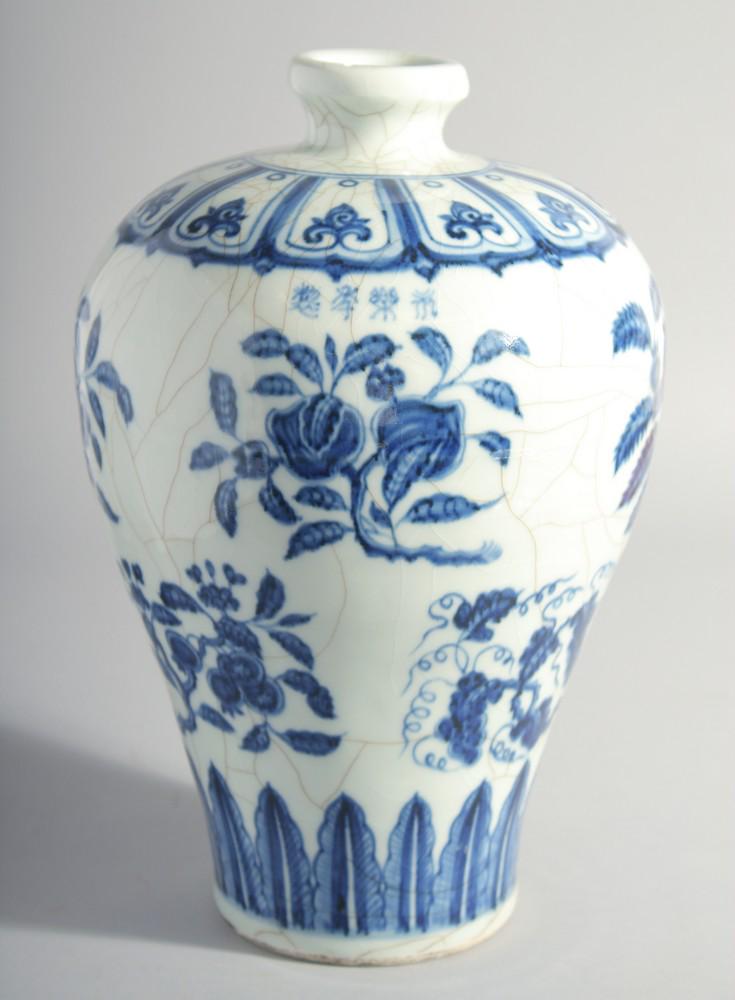 A CHINESE MING STYLE BLUE AND WHITE MEIPING VASE, decorated with various blossoming fruit, 29cm: A CHINESE MING STYLE BLUE AND WHITE MEIPING VASE, decorated with various blossoming fruit, 29cm high.