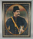 A PERSIAN QAJAR OIL ON TIN PORTRAIT PAINTING OF PRINCE MAS'UD MIRZA, YAMIN AL-DAWLA ZILL AL-SULTAN