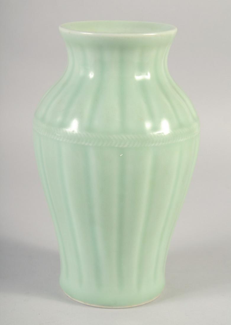 A CHINESE CELADON GLAZE PORCELAIN VASE, with six-character mark to base, 23cm high.: A CHINESE CELADON GLAZE PORCELAIN VASE, with six-character mark to base, 23cm high.