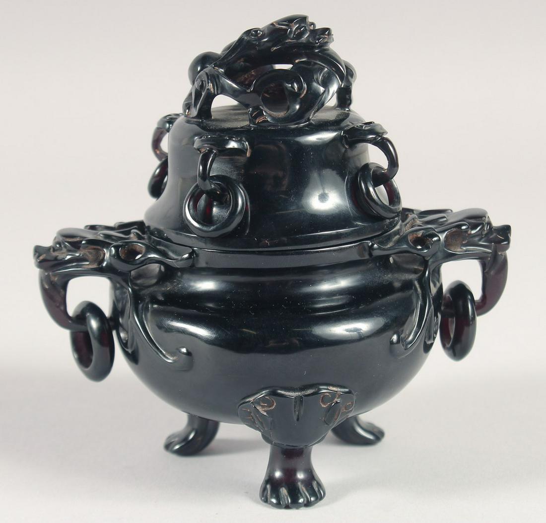 A FINE EARLY 20TH CENTURY CHINESE BAKELITE LIDDED CENSER, 12cm high.: A FINE EARLY 20TH CENTURY CHINESE BAKELITE LIDDED CENSER, 12cm high.