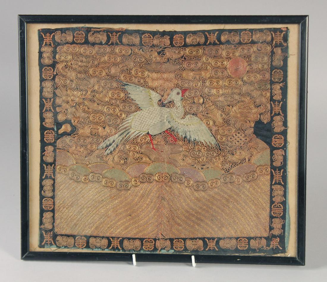 A 19TH CENTURY CHINESE TEXTILE OF AN OFFICIAL'S RANKING BADGE, framed and glazed, textile 32cm x: A 19TH CENTURY CHINESE TEXTILE OF AN OFFICIAL'S RANKING BADGE, framed and glazed, textile 32cm x 29cm.