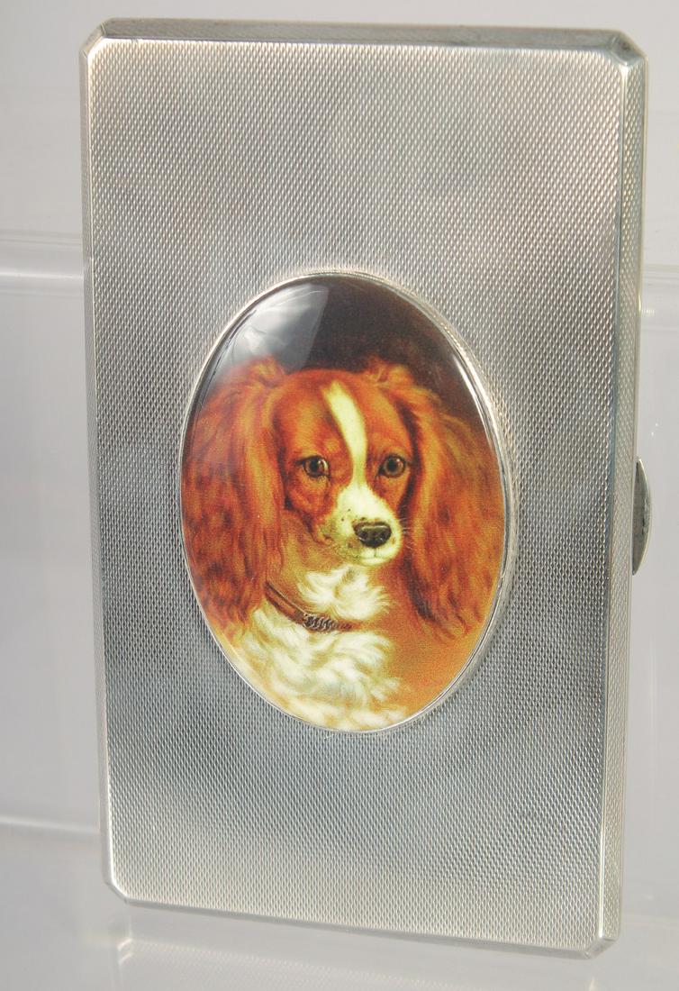 A GOOD LARGE HEAVY ENGINE TURNED CIGARETTE CASE with and oval enamel of a King Charles Spaniel.: A GOOD LARGE HEAVY ENGINE TURNED CIGARETTE CASE with and oval enamel of a King Charles Spaniel. 5.5ins x 3ins 242gms. Birmingham 1934.