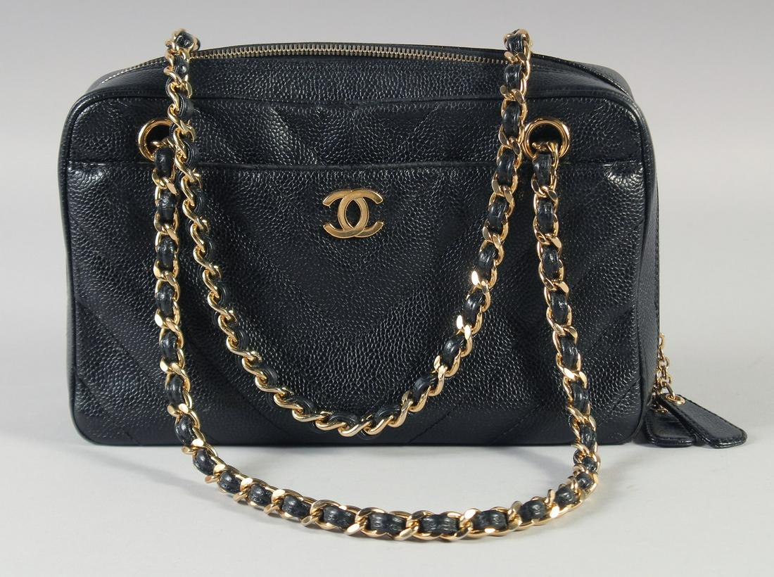 A GOOD CHANEL BLACK CROCODILE HAND BAG  25cm long, 15cm high with long gilt and leather double (1 of 8)