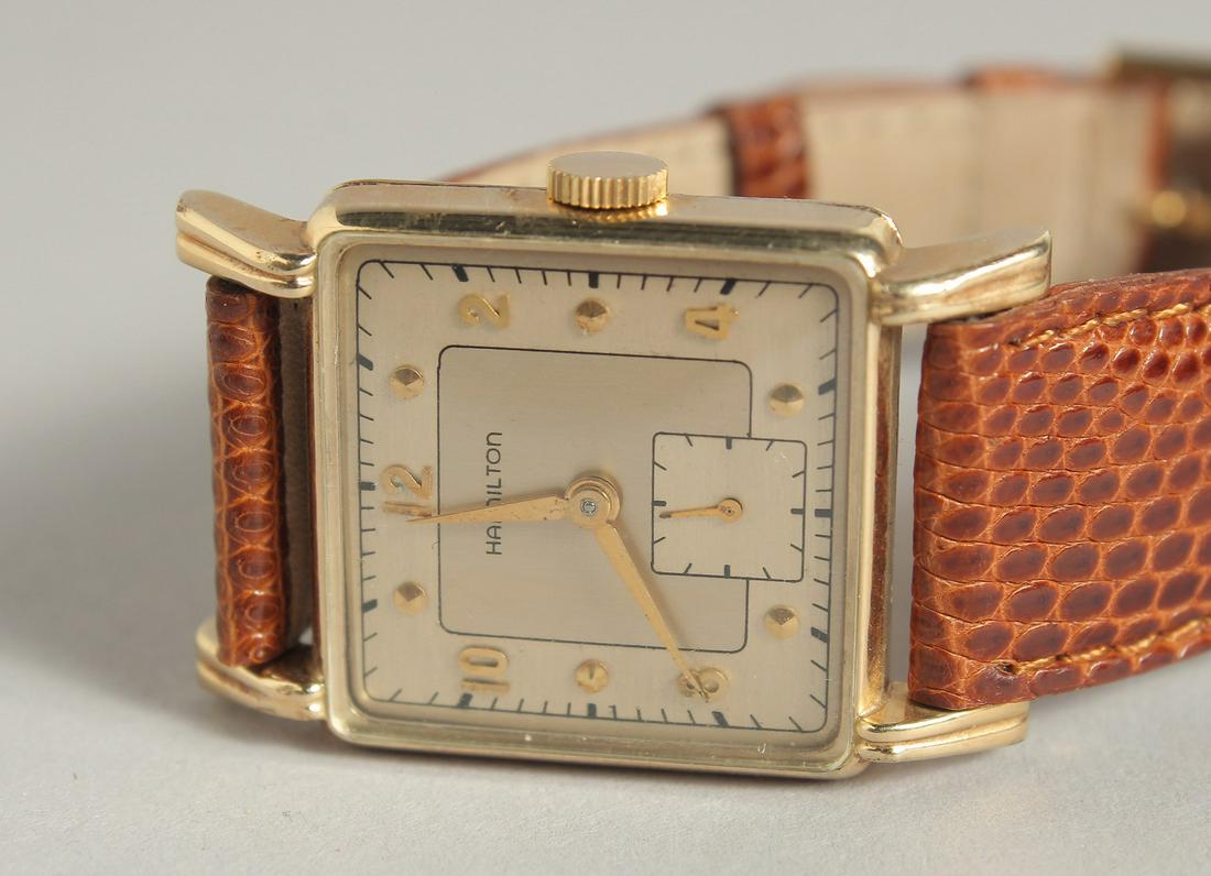A GOOD HAMILTON GOLD WRIST WATCH with snake skin strap.: A GOOD HAMILTON GOLD WRIST WATCH with snake skin strap.