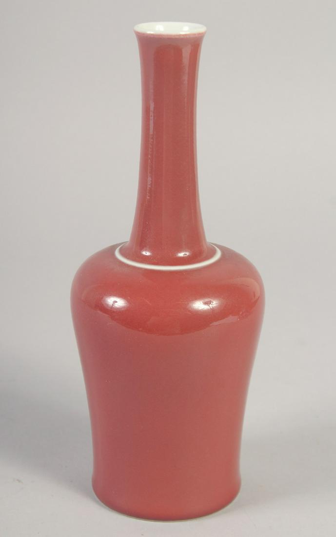 A CHINESE REPUBLIC COPPER RED GLAZE BOTTLE VASE, the base with character mark, 23cm high. (1 of 6)