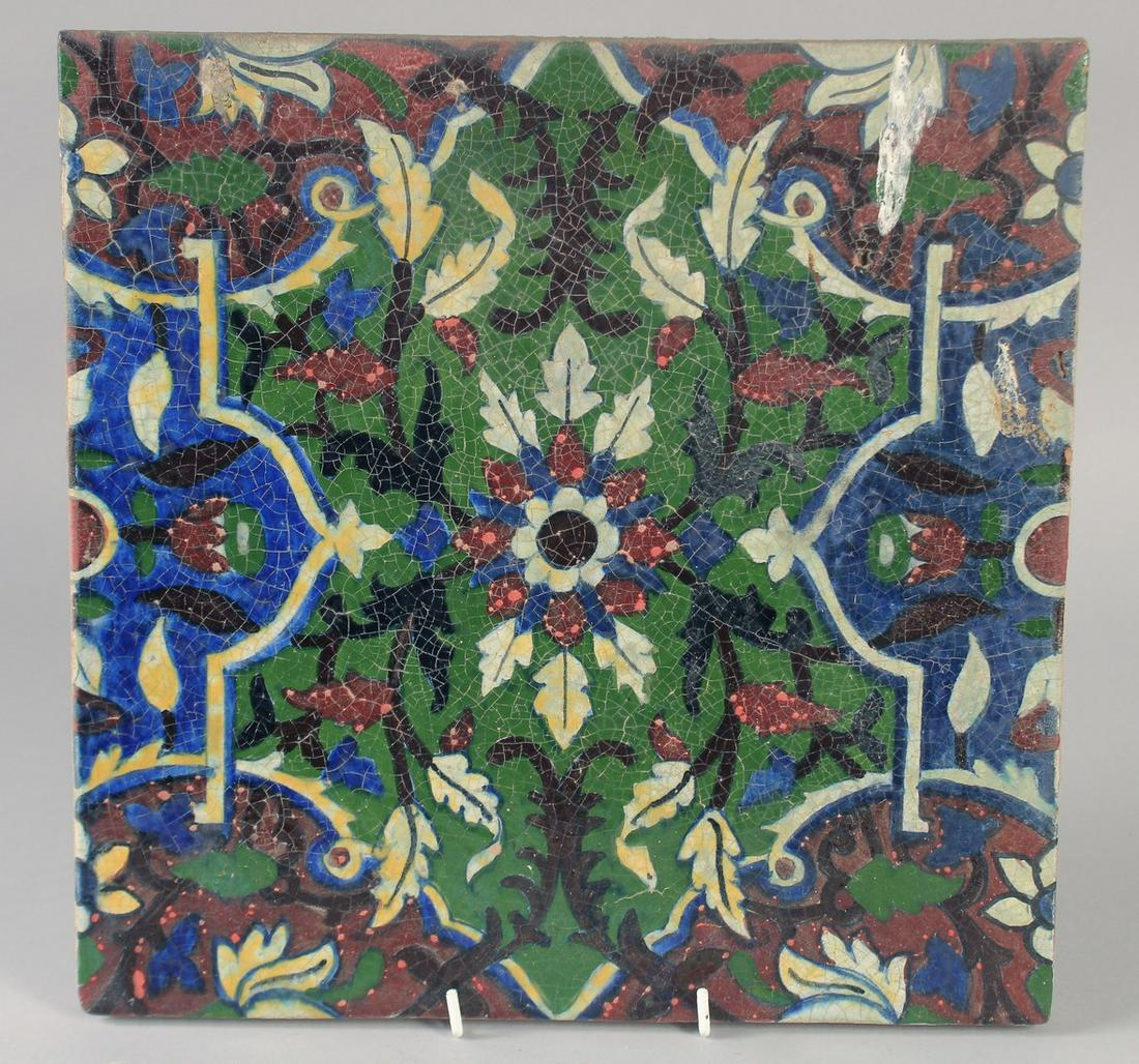A FINE AND UNUSUAL LARGE 19TH CENTURY INDIAN TILE, with floral motif, 30.5cm square.: A FINE AND UNUSUAL LARGE 19TH CENTURY INDIAN TILE, with floral motif, 30.5cm square.