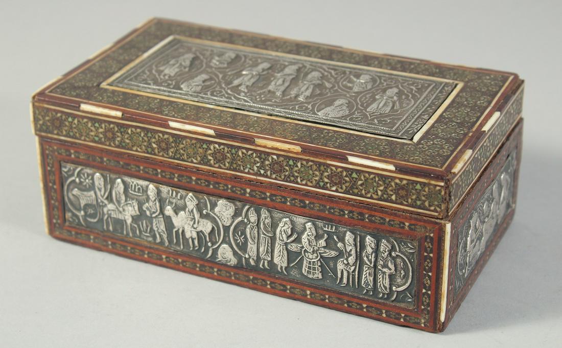 A PERSIAN SHIRAZ SILVER PANELLED MICRO MOSAIC INLAID BOX, the panels embossed and chased with: A PERSIAN SHIRAZ SILVER PANELLED MICRO MOSAIC INLAID BOX, the panels embossed and chased with figures, 17cm x 10cm.