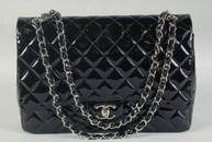 A VERY GOOD LARGE CHANEL BLACK PATENT LEATHER HANDBAG with long chrome and leather straps.  33cm