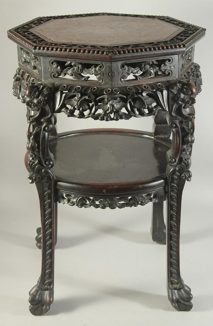 A FINE CHINESE MARBLE INSET CARVED HARDWOOD OCTAGONAL STAND, with carved and pierced foliate frieze (1 of 6)