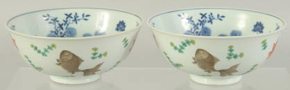 A PAIR OF CHINESE FAMILLE ROSE PORCELAIN BOWLS, the exterior painted with coral red fish, the