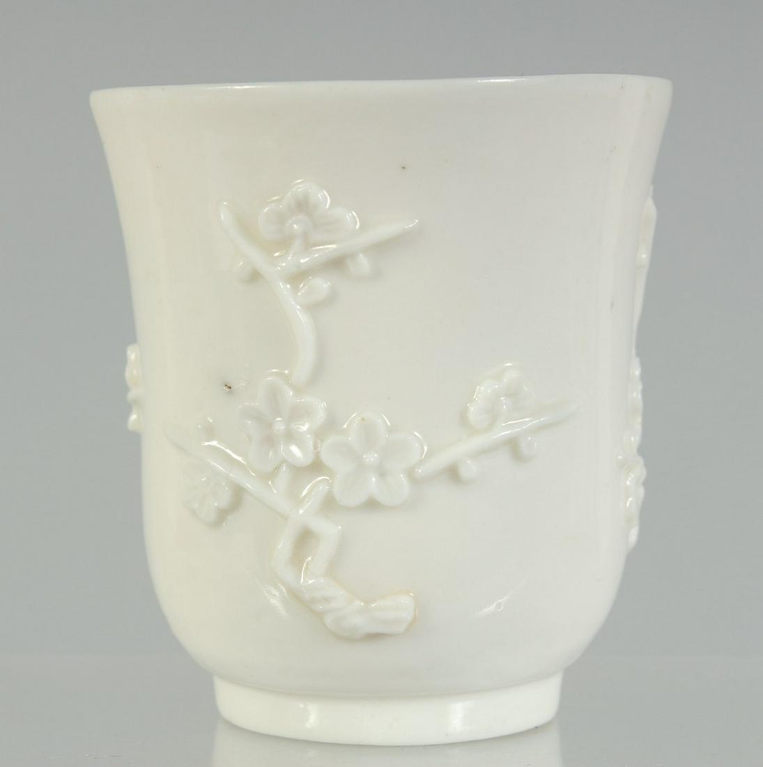 A BLANC-DE-CHINE BEAKER, with relief floral decoration, 7.5cm high, 7.5cm diameter.: A BLANC-DE-CHINE BEAKER, with relief floral decoration, 7.5cm high, 7.5cm diameter.