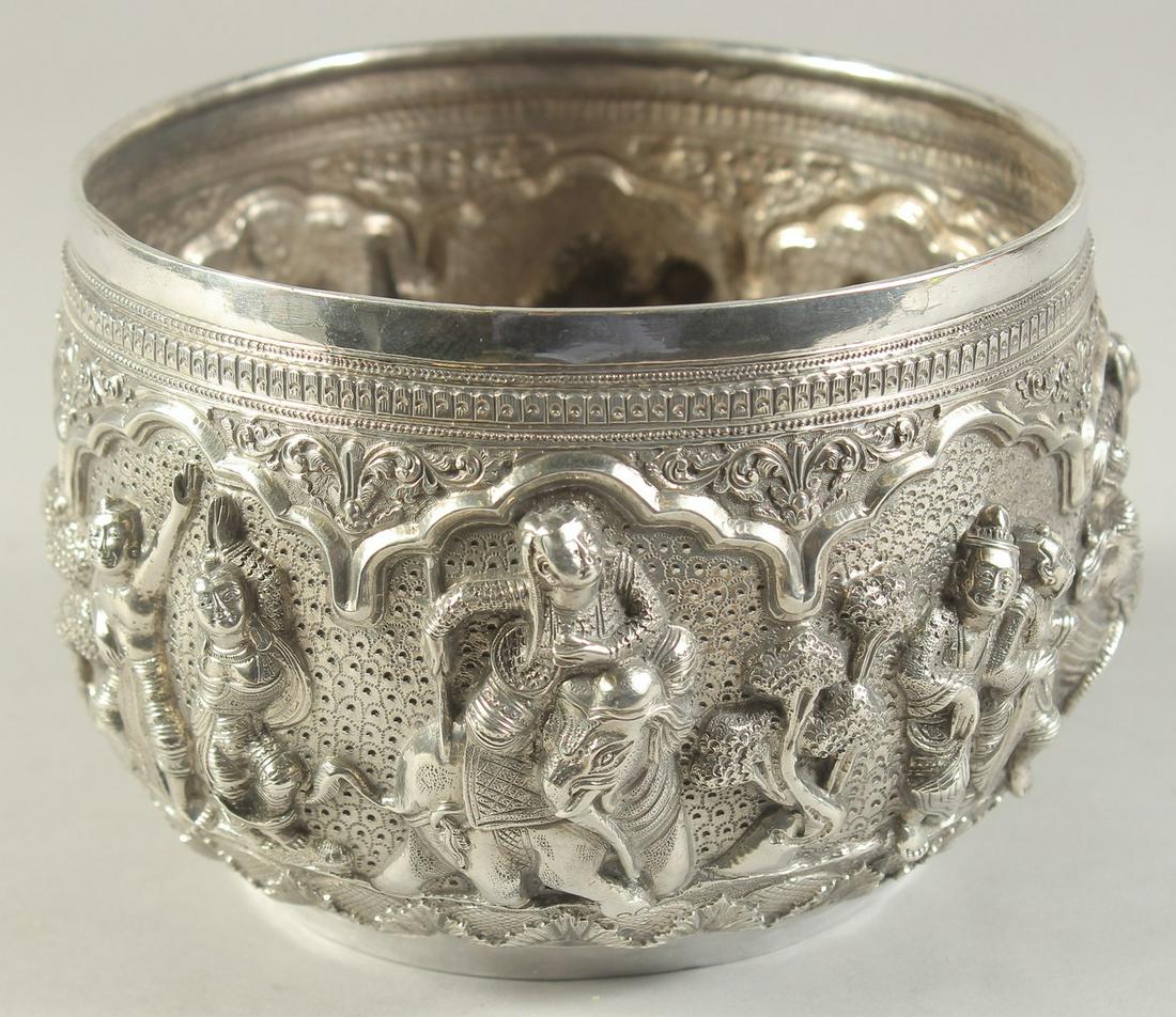 A 19TH CENTURY BURMESE SILVER BOWL, with fine repose figural decoration, 16cm diameter. (1 of 6)