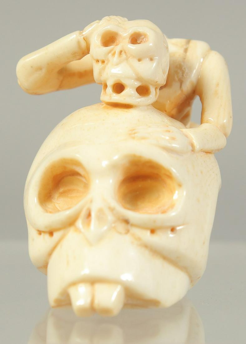 A CHINESE CARVED BONE SKULL AND SKELETON.: A CHINESE CARVED BONE SKULL AND SKELETON.