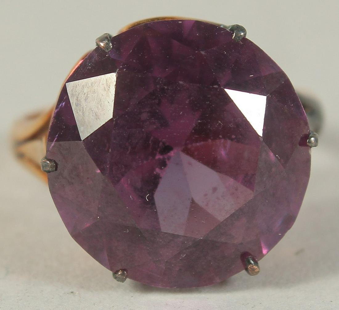A LARGE SINGLE STONE SYNTHETIC ALEXANDRITE set in 14ct gold. (1 of 6)