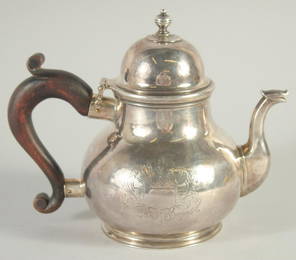 A RARE GEORGE 1st SILVER GLOBULAR TEA POT AND COVER with wooden handle  London 1725.  Maker, George