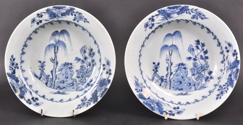 A PAIR OF 18TH CENTURY CHINESE NANKING CARGO BLUE : A PAIR OF 18TH CENTURY CHINESE NANKING CARGO BLUE AND WHITE DISHES painted with flowering rock. One good condition, one with nick. 9ins diameter. Provenance: Christies, Lot 4183