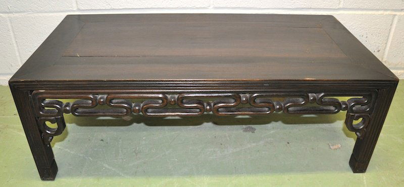A CHINESE ROSEWOOD LOW TABLE with carved and pierc: A CHINESE ROSEWOOD LOW TABLE with carved and pierced decoration. 2ft 9. 5ins long x 1ft 5ins wide x 11ins high.