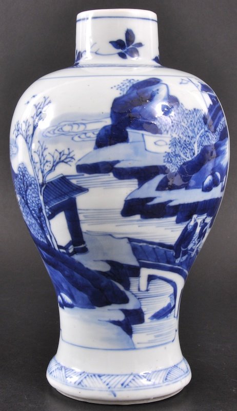 A CHINESE KANGXI BLUE AND WHITE BALUSTER VASE C17: A CHINESE KANGXI BLUE AND WHITE BALUSTER VASE C1700 painted with panels of landscapes, under a foliate and hatched rim. Good condition. 8. 75ins high.