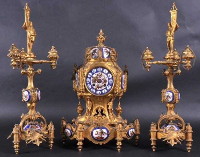 A VERY GOOD FRENCH ORMOLU AND PORCELAIN GARNITURE: A VERY GOOD FRENCH ORMOLU AND PORCELAIN GARNITURE DE CHEMINEE by LE ROY & FILS PARIS, a central clock with superb porcelain dial. Signed, inscribed and set with other seven porcelain panels and domed