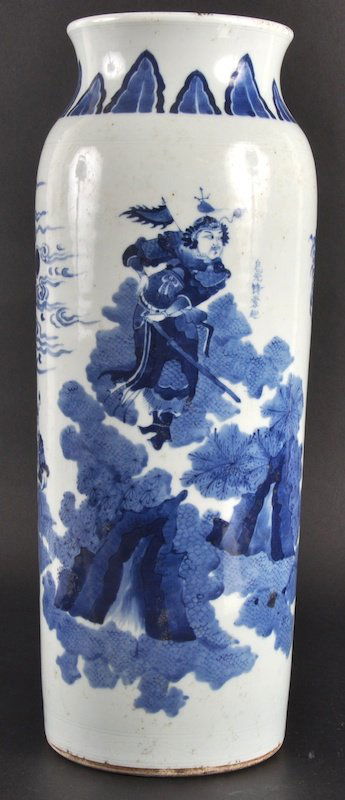 A 19TH CENTURY CHINESE BLUE AND WHITE CYLINDRICAL: A 19TH CENTURY CHINESE BLUE AND WHITE CYLINDRICAL VASE in the Transitional style, painted with warriors within a landscape. Surface blemishes.17.5ins high.