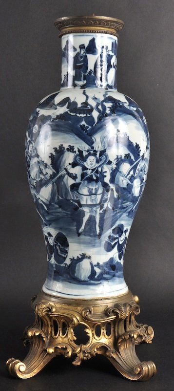 AN EARLY 19TH CENTURY CHINESE BLUE AND WHITE BAL: AN EARLY 19TH CENTURY CHINESE BLUE AND WHITE BALUSTER VASE converted to a lamp, with French ormolu mounts to top and bottom. Repair to rim.21.5ins high overall.
