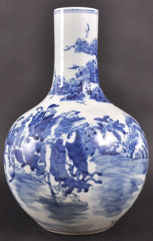 A 20TH CENTURY CHINESE BLUE AND WHITE PORCELAIN VA: A 20TH CENTURY CHINESE BLUE AND WHITE PORCELAIN VASE of Kangxi design. Minor crazing.13.75ins high.